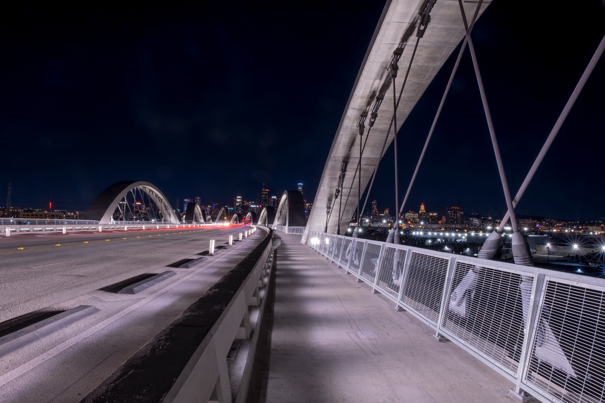 New 6th Street bridge in Los Angeles at night with the Los Angles skyline background, California.